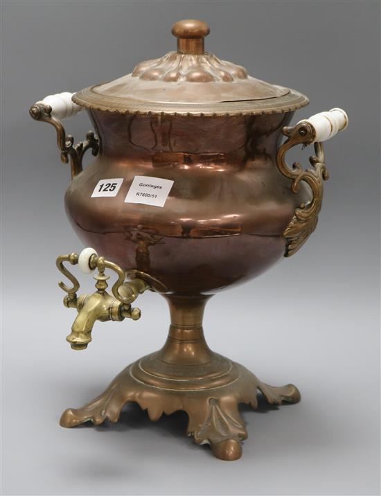 A Victorian copper tea urn, with white glass carrying handles height 40cm